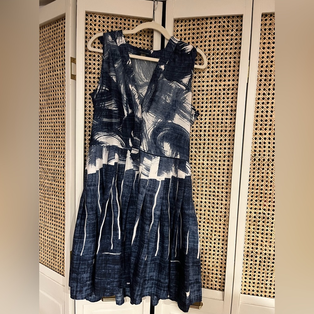 Classic style daytime dress with pleated skirt